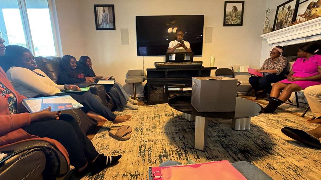 A small group Bible study meeting in a member's living room